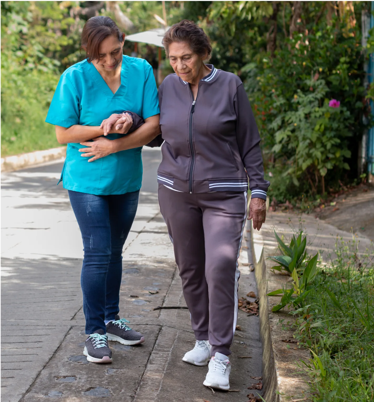nurse-assisting-an-elderly-woman-with-walking-diff-2023-01-25-11-24-54-utc