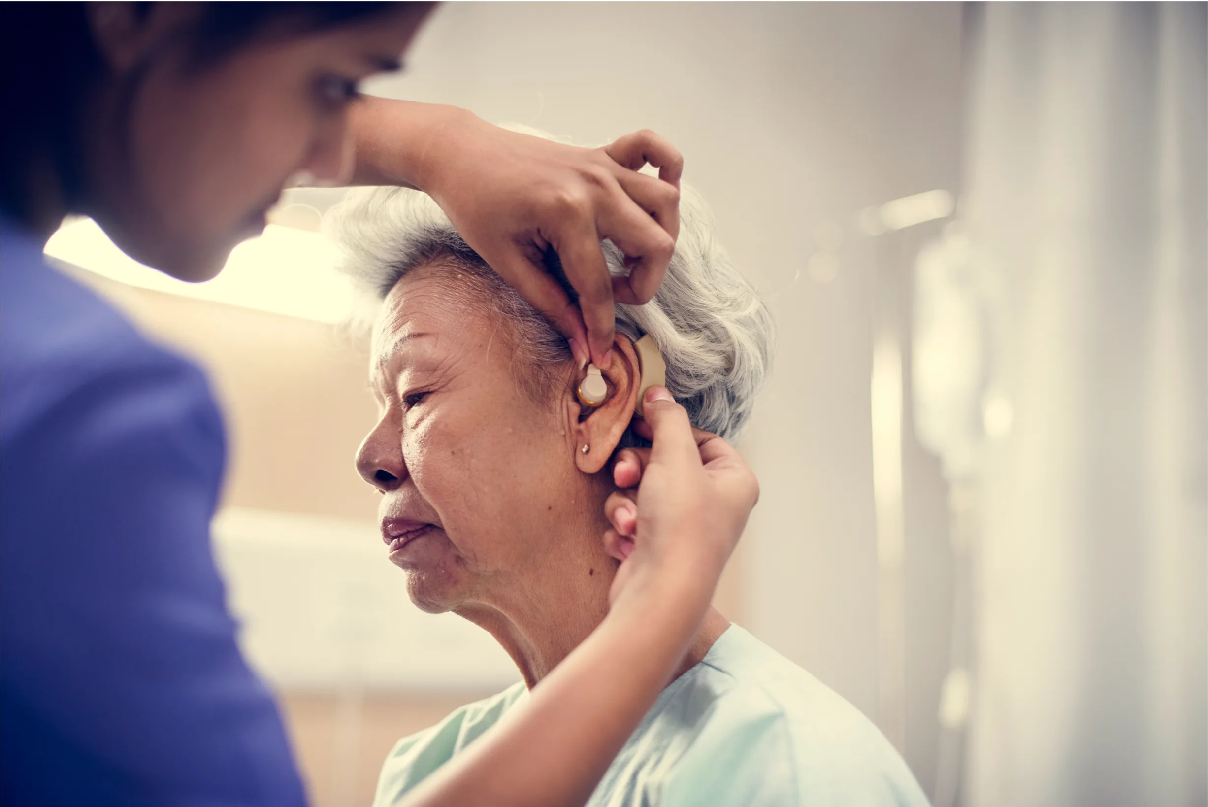 an-elderly-woman-with-hearing-aid-2022-12-15-23-08-05-utc