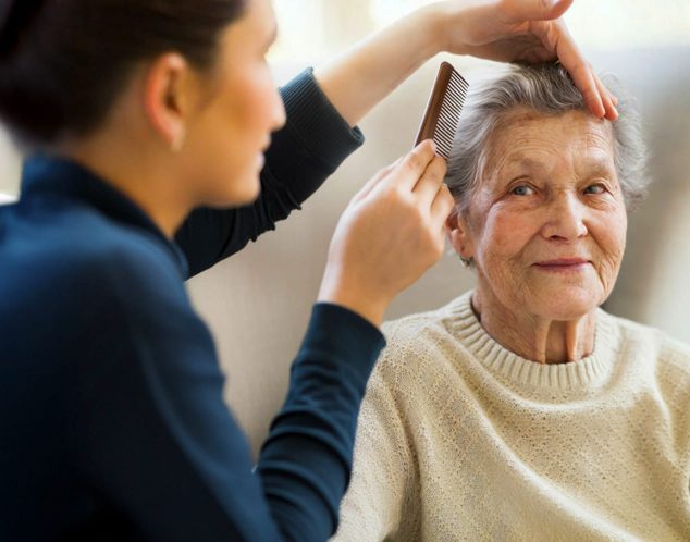 About Us - True Care Home Care - NYC & Westchester County - caregiver helps brushing to a patient